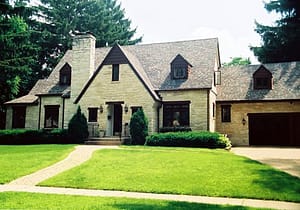 Beautiful stone home in Maple Bluff on a summer day in Wisconsin