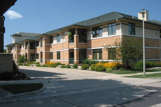 Middleton Hills Multi‑story condominium exterior on a sunny day in Wisconsin