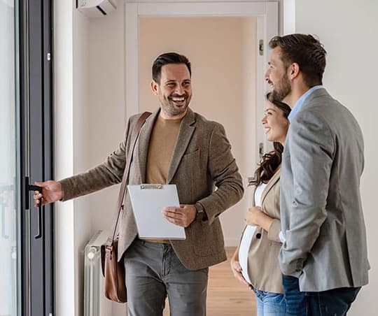 Young couple working with their buyer's agent